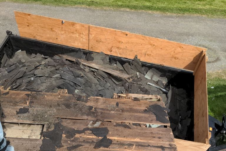 Dumpster Full Of The Old Shingles