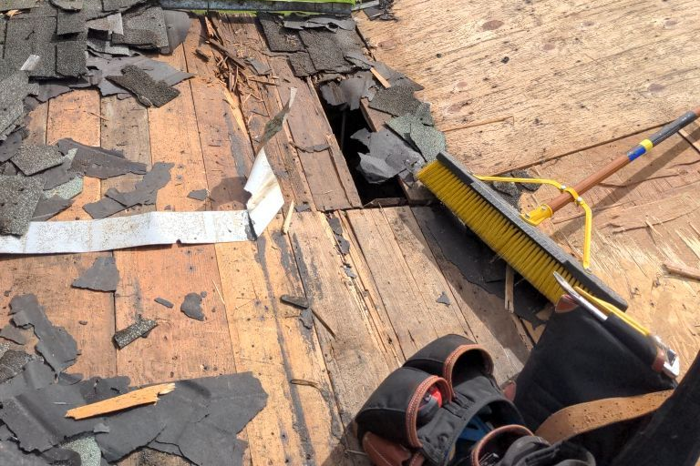 Sweeping Shingles Off Of Roof