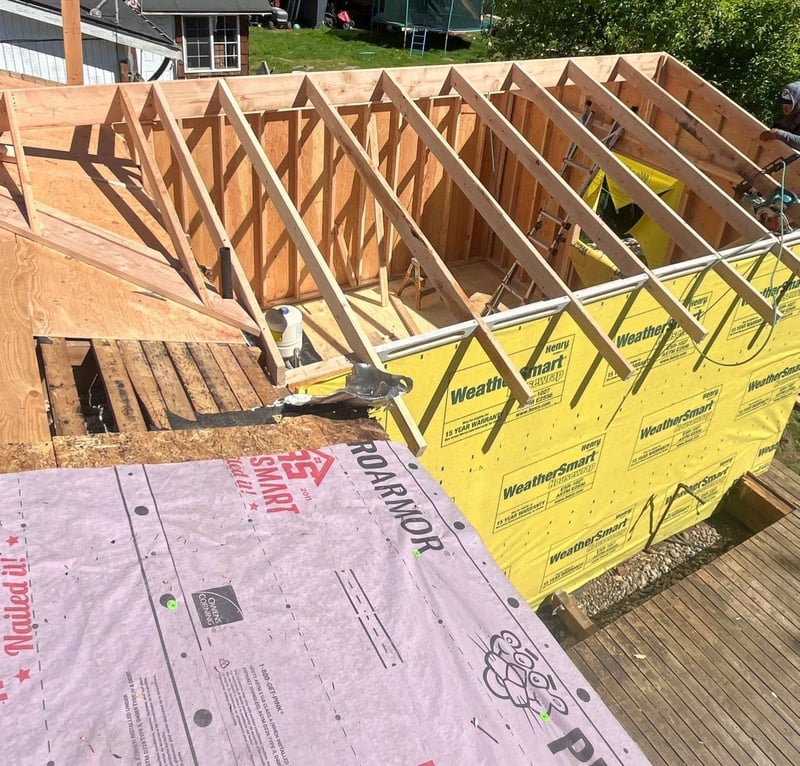 walls up and roof framing installed on new addition