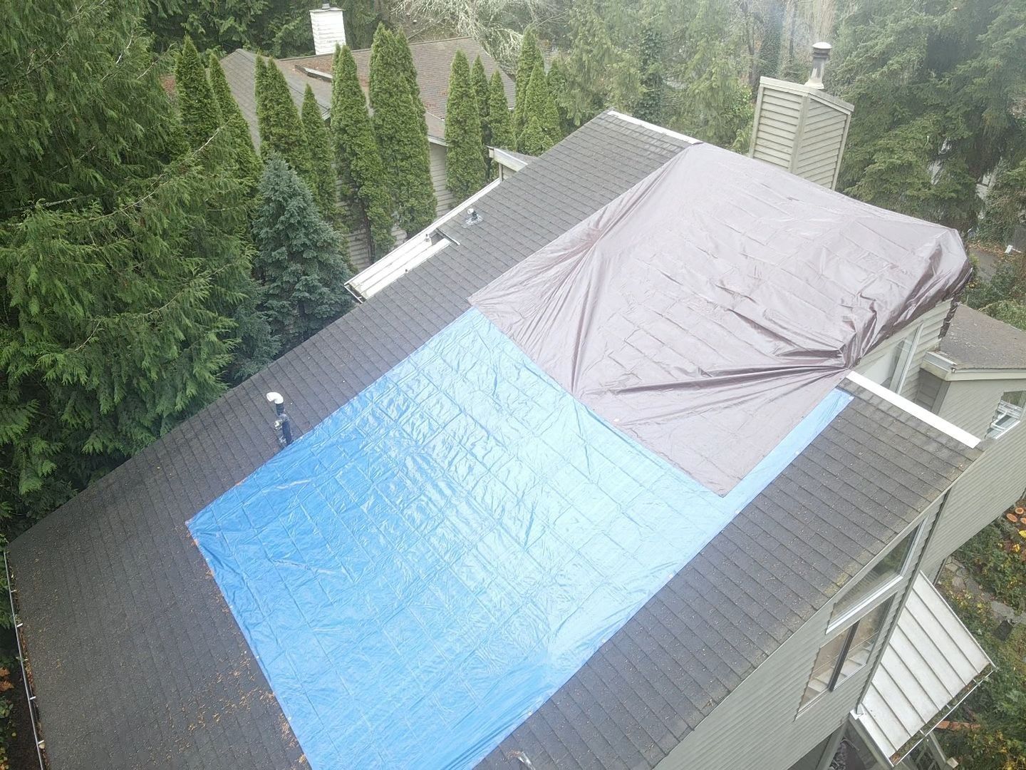 Roof tarped to stop a leak