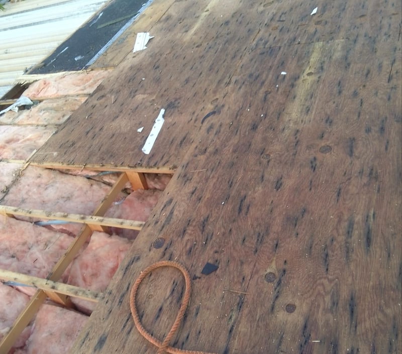 rotting wood on a low slope roof