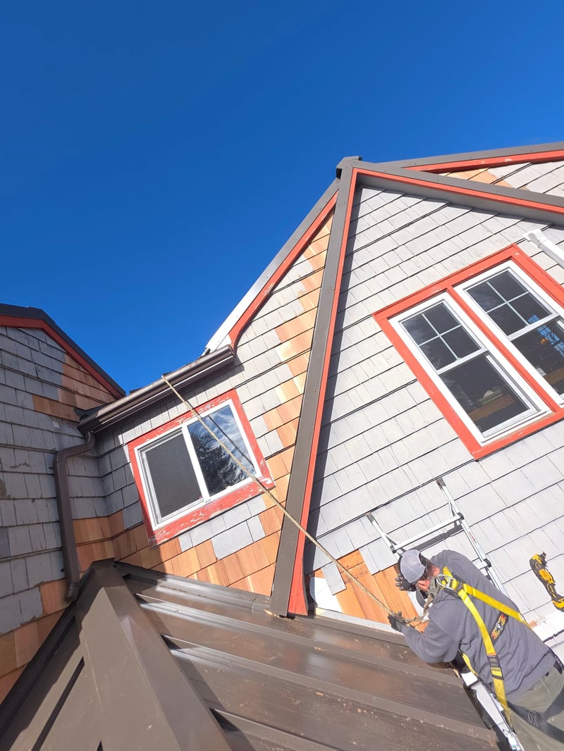 cedar shake siding replacement on home with metal roof