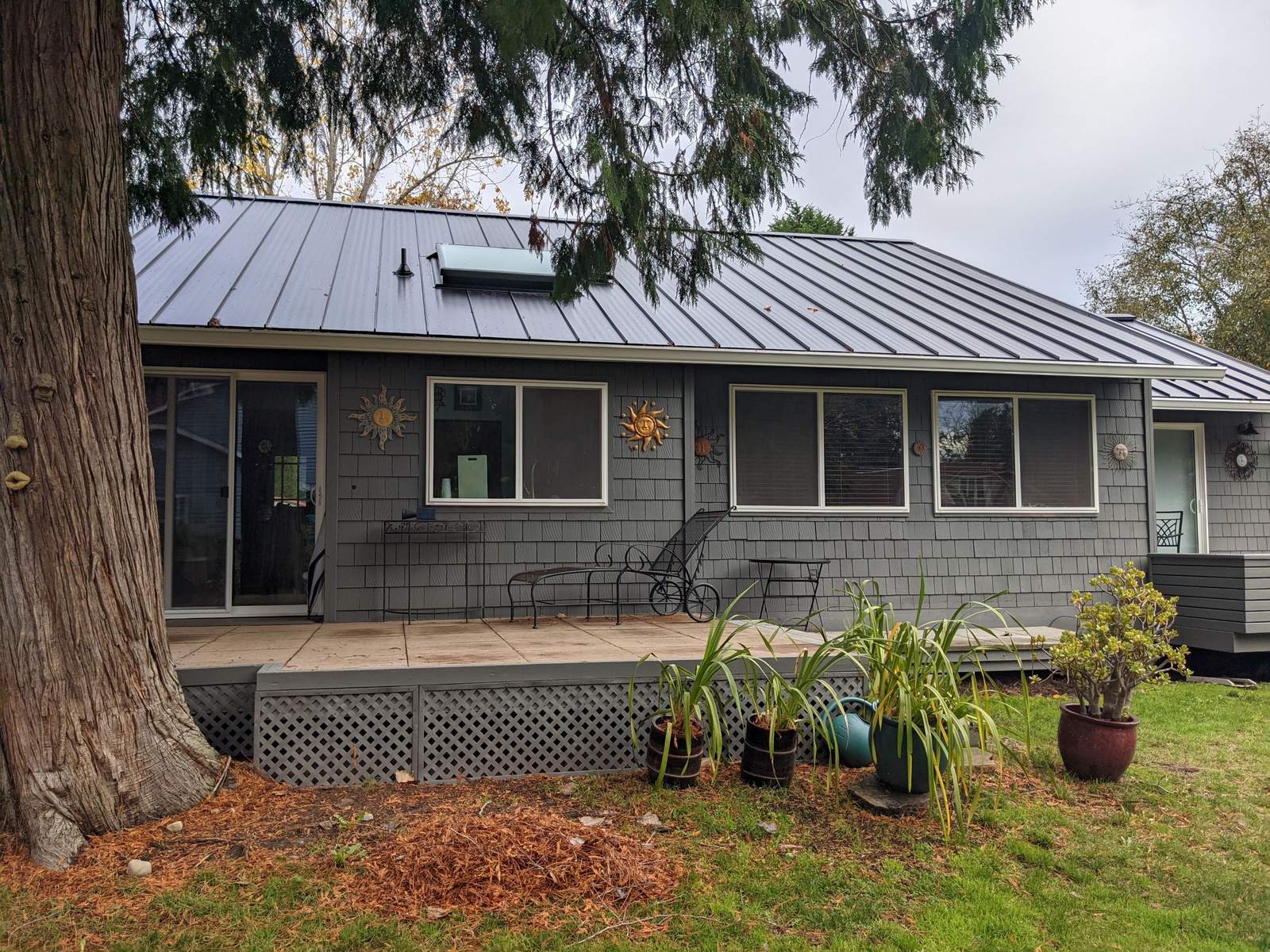 Black standing seam metal roof on a home in Normandy Park