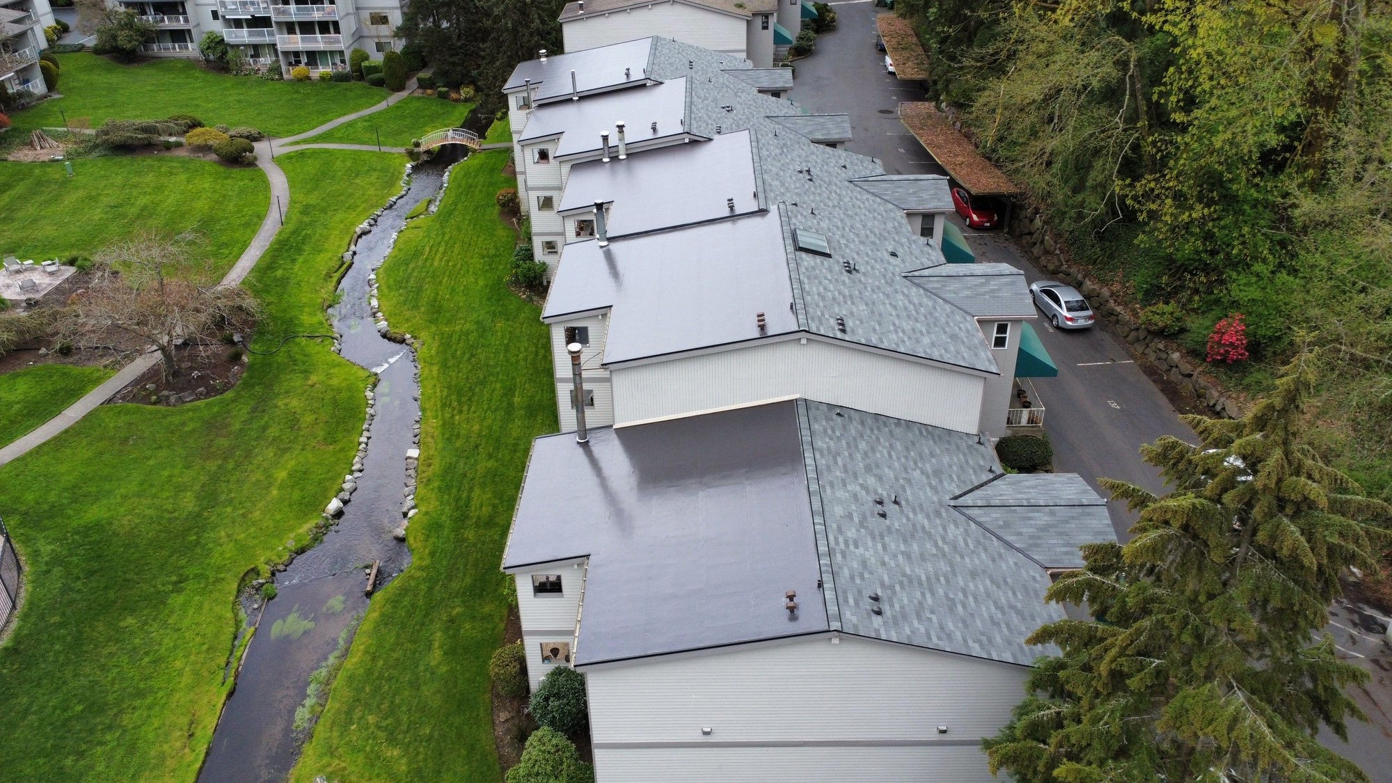multi-family flat and shingle roofs