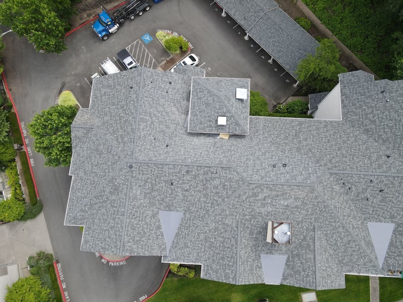 shingles on apartment complex with pvc patches