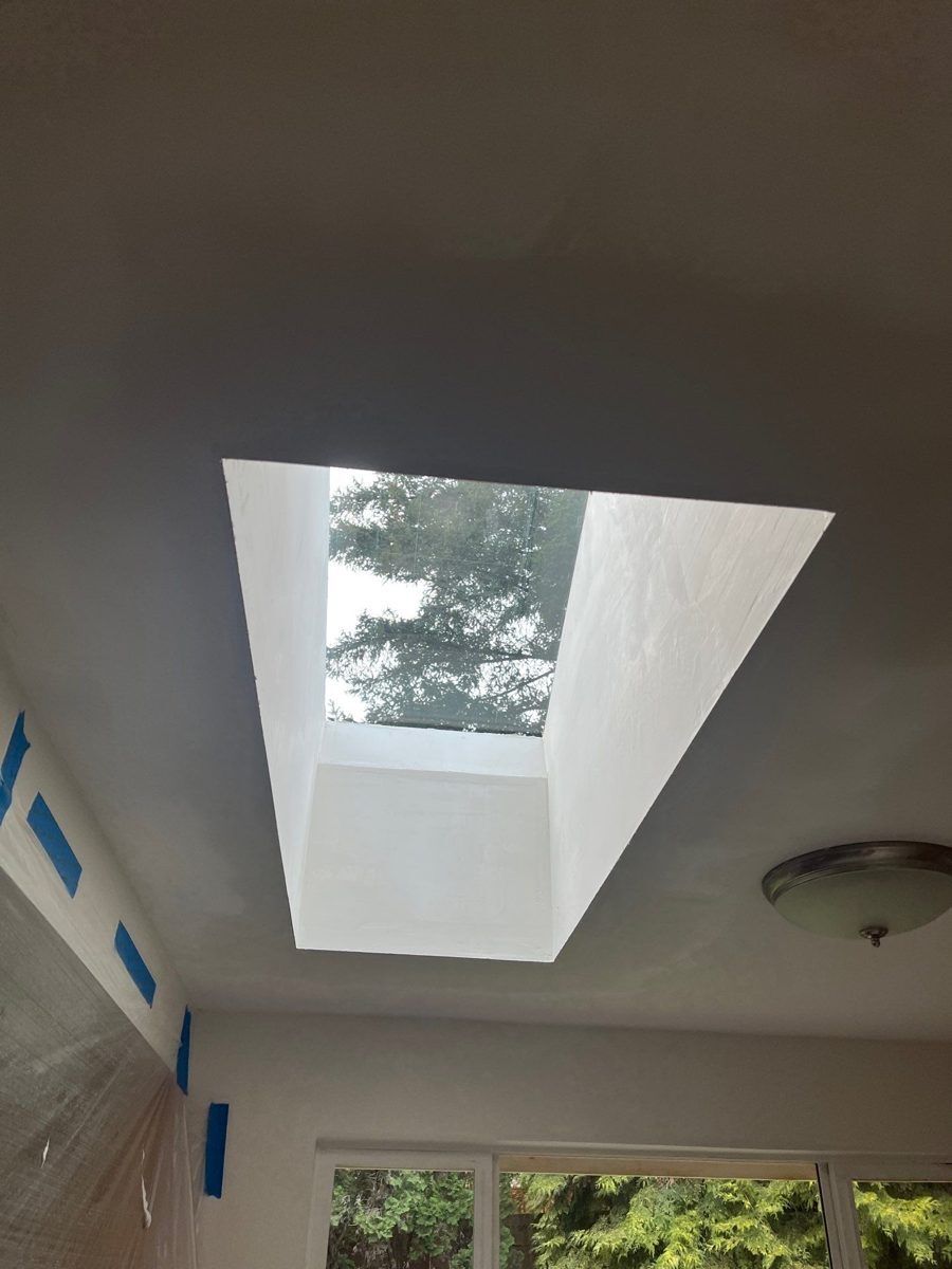 Finished skylight well seen from inside a room, letting daylight in