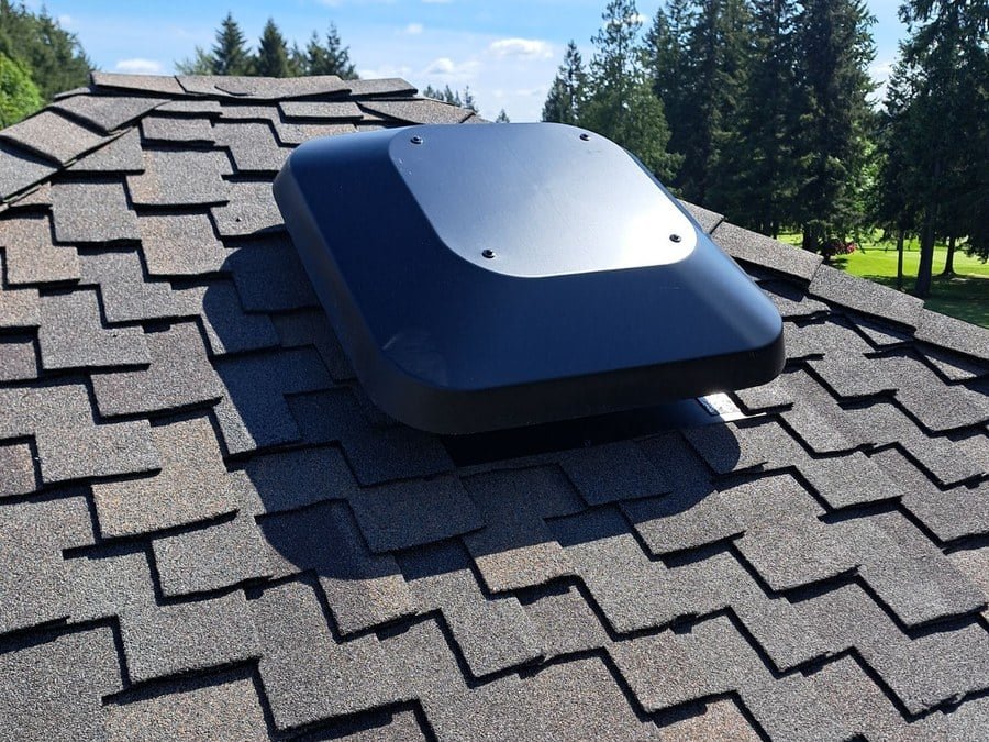 Kent: a power attic vent on architectural shingles.