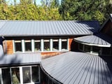 Olympia: a drone view of the house and its old metal roof before replacement.