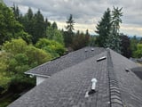 Clyde Hill: an elevated view of the finished gray asphalt roof.